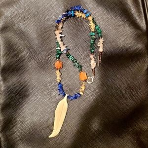 Nice quality carved feather necklace